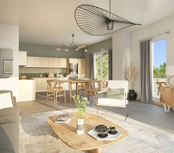 Intérieur lumineux d'un loft moderne avec cuisine ouverte, mobilier en bois naturel et sol en béton poli.