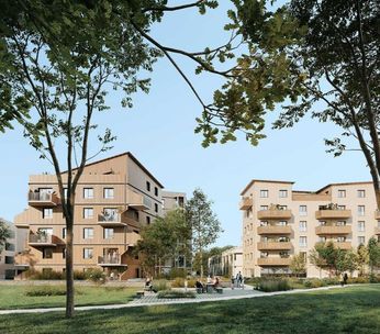 Ensemble d'immeubles résidentiels de quatre étages entourés d'arbres et d'espaces verts, sous ciel dégagé.