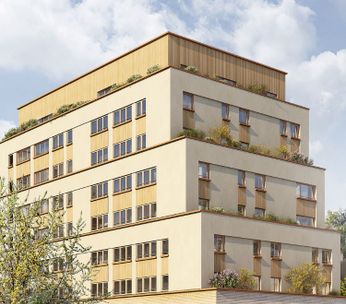 Immeuble résidentiel moderne aux façades jaune et beige, entouré d'arbres et de bâtiments classiques, sous un ciel dégagé.
