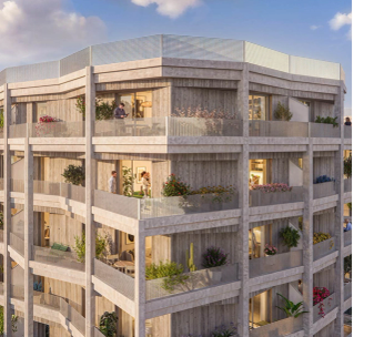 Immeuble résidentiel moderne de quatre étages avec façade beige et balcons arrondis, photographié de jour.