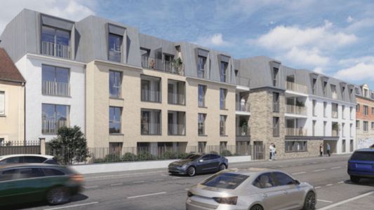 Immeuble résidentiel moderne aux façades jaune et gris avec voitures garées devant.