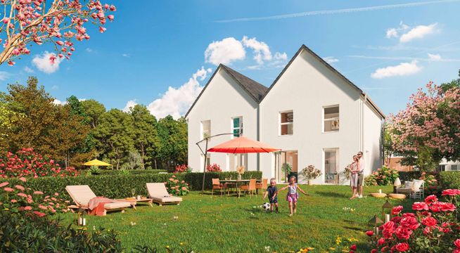 Maison blanche avec toit gris entourée d'un jardin fleuri aux arbres d'automne rouges.