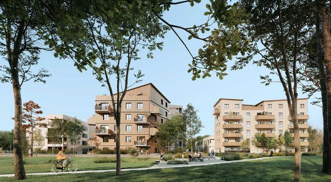 Ensemble immobilier résidentiel de briques rouges entouré de verdure et d'arbres matures sous ciel dégagé.