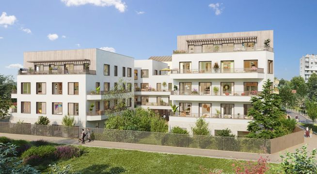 Immeubles résidentiels modernes avec façades beiges, espaces verts et ciel bleu dégagé.