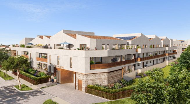 Immeuble résidentiel moderne aux façades blanches et beige, avec terrasses, entouré de végétation verte.