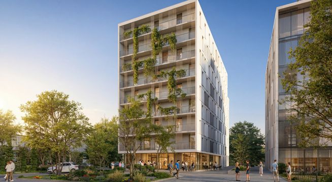 Bâtiments modernes avec façades vertes, arbres et espaces verts au crépuscule.