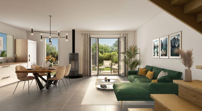 Salon moderne avec canapé vert, mobilier en bois clair et baies vitrées donnant sur un jardin.