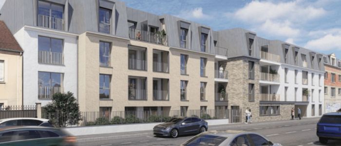 Immeuble résidentiel moderne aux façades jaune et gris avec voitures garées devant.